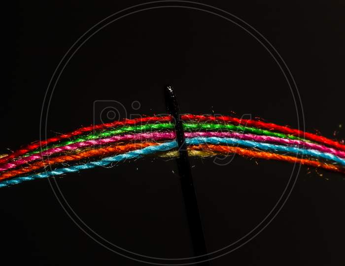 Colorful threads in a needle