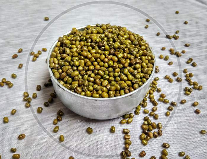 green mung beans in a bowl it is alternatively known as the green gram maash or moong