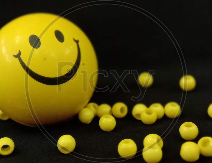 Yellow coloured smiley ball