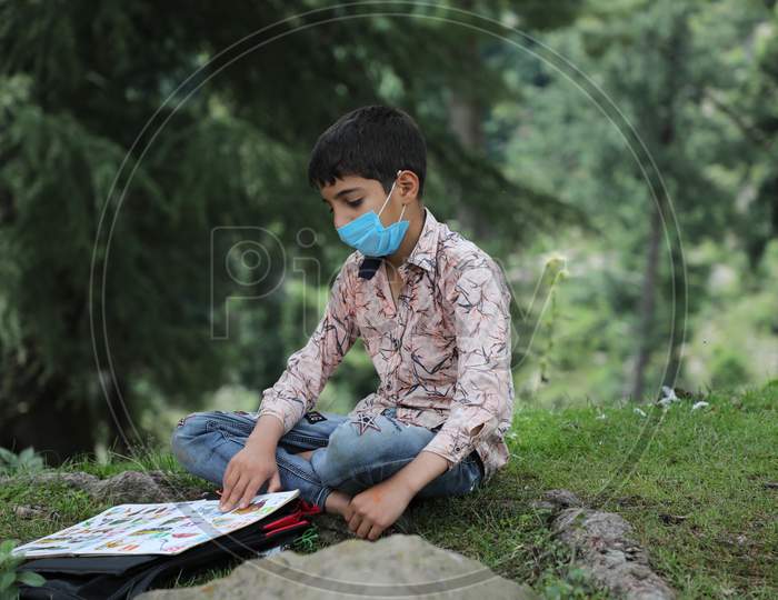 Children of the Bakarwal community attend classes at an open-air mobile school in Sanasar,on August 5 2020. Due to Coronavirus Covid-19 pandemic all educational institutions in India are closed and students learn only online.