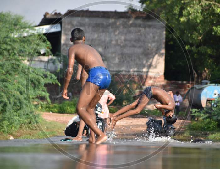 kids diving in river, kids bathing in river
