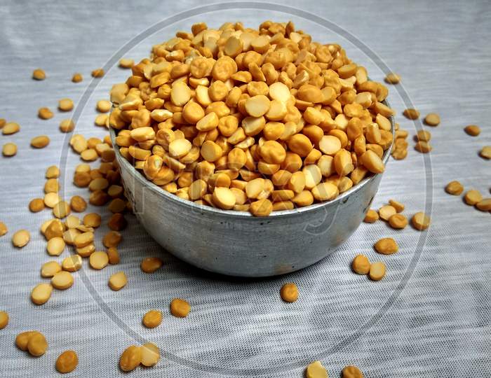A full bowl of split chickpea. The chickpea or chick pea, Its different types are variously known as gram or Bengal gram, garbanzo or garbanzo bean, Egyptian pea. Chickpea seeds are high in protein