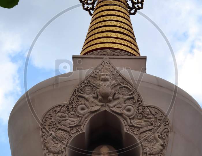 New temple of lord Buddha in Varanasi with golden arc.