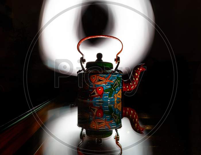 A tea pot with aesthetic background
