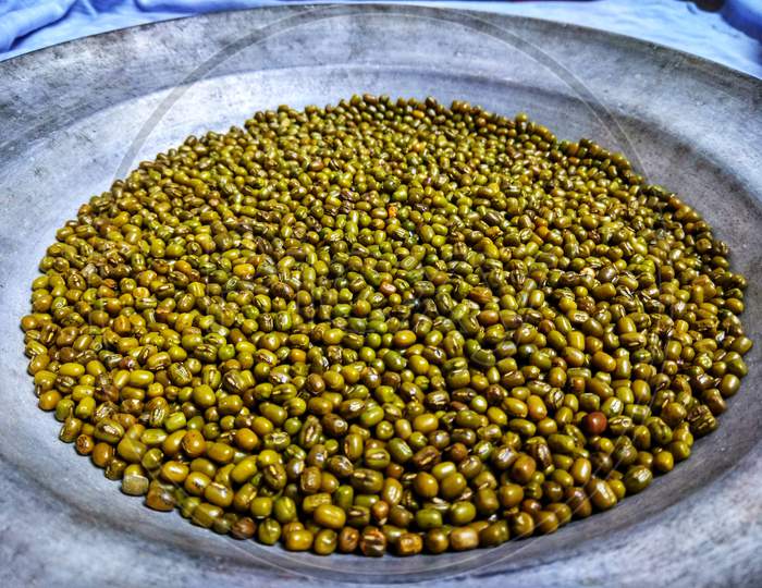 green mung beans in a bowl it is alternatively known as the green gram maash or moong