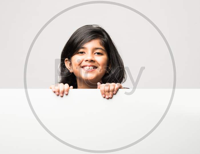 Indian Asian Cute Little Girl Pointing At Blank White Board With Grandpa Or Grandfather