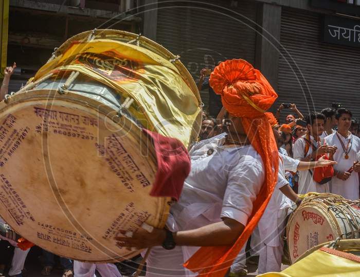 Pune, India - September 4, 2017: Member Of Shivmudra Dhol Tasha Pathak Lifting The Dhol And Playing On The Occasion Of Ganpati Visarjan Festival / Anant Chaturdashi Festival Celebration In Pune.