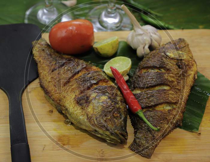 Tilapia fish. It's a shallow  fried fish. Considered as one of the low price and highly tasty fish.