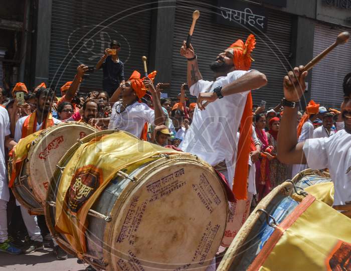 Pune, India - September 4, 2017: Shivmudra Dhol Tasha Pathak Happily Jumping And Playing Dhol On The Streets Of Pune On The Occasion Of Ganpati Visarjan Festival. Dhol Tasha Pathak Raising Their Hand