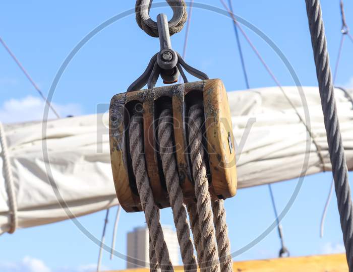 Detailed Close Up Detail Of Ropes And Cordage In The Rigging Of An Old Wooden Vintage Sailboat