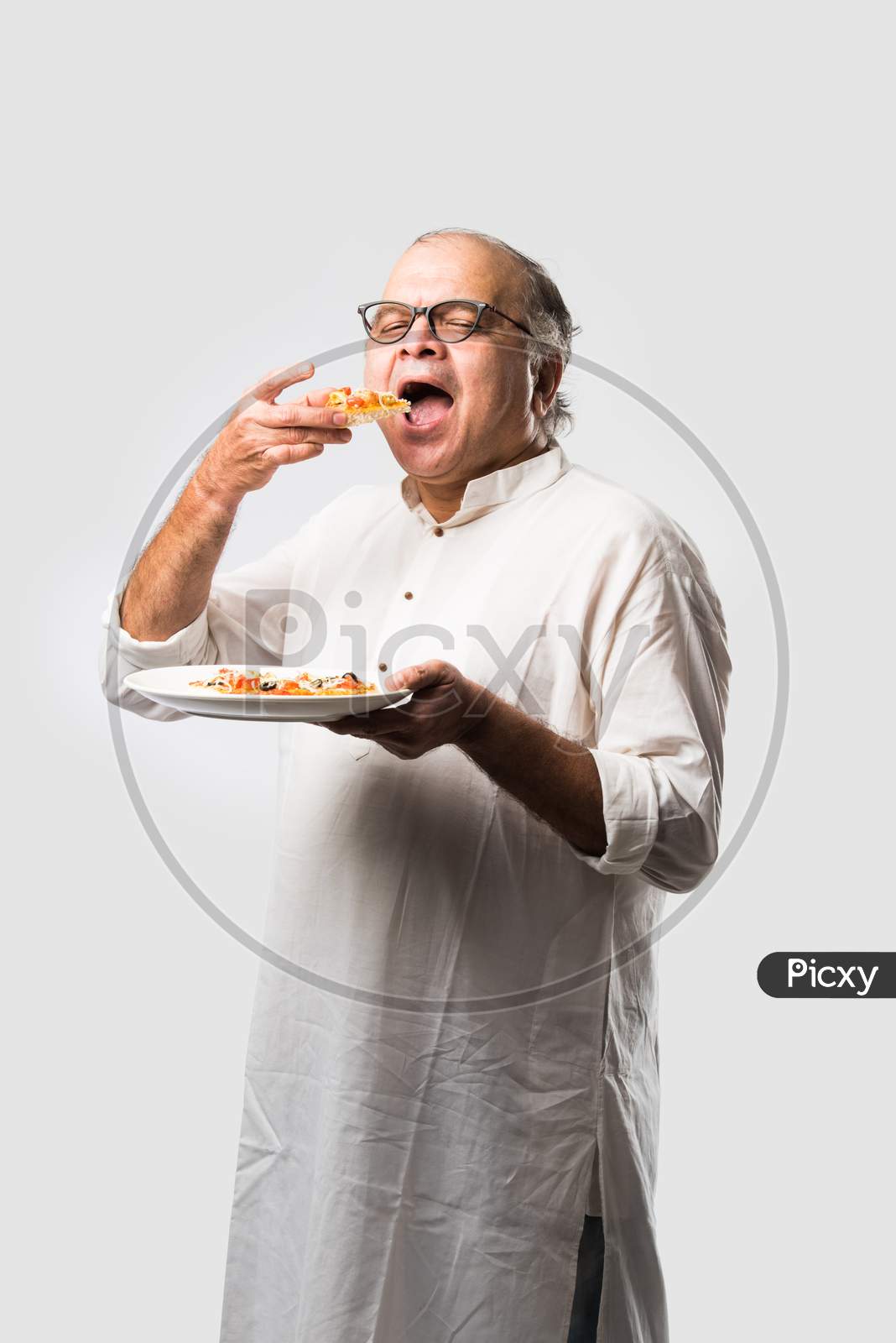 Asian Indian Old Man Eating Pizza With Funny Expressions
