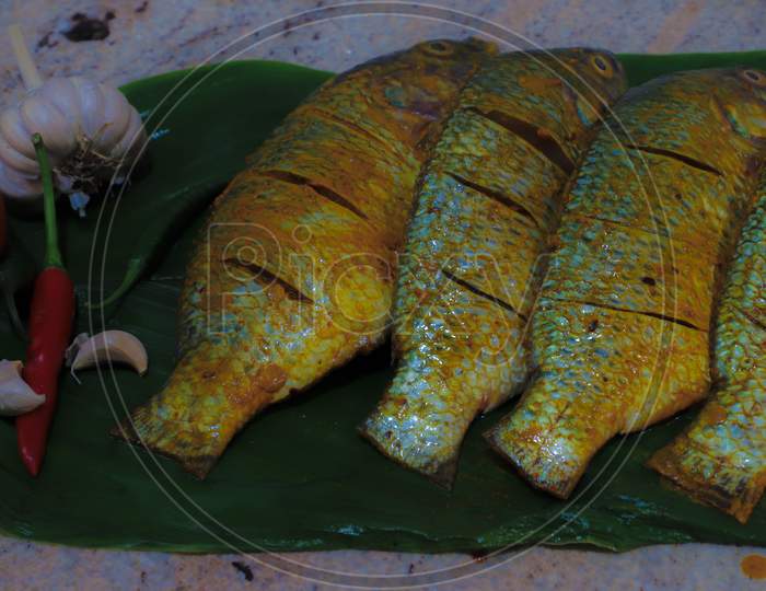 Tilapia fish. Processed before frying.. Considered as one of the low price and highly tasty fish.