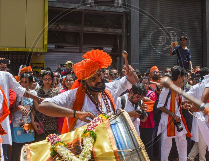 Pune, India - September 4, 2017: Closeup Of A Member From Shivmudra Dhol Tasha Pathak Passionately Playing Dhol / Drum On The Streets Of Pune On The Occasion Of Ganpati Visarjan Festival.