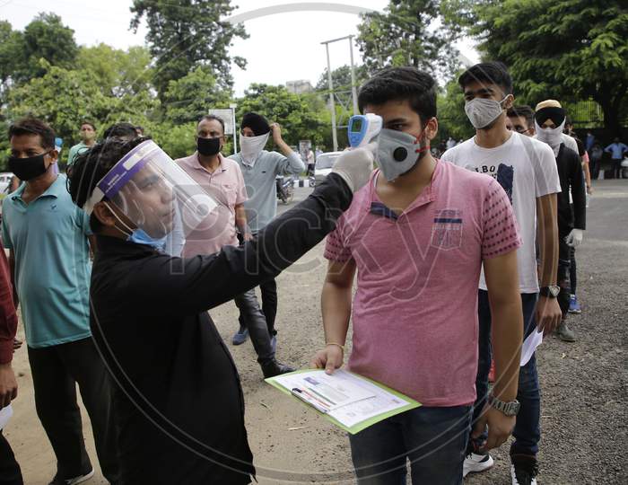 National Defence Academy (NDA) aspirants being screened as per COVID-19 protocol before allowing into an examination centre in Jammu August 6, 2020.