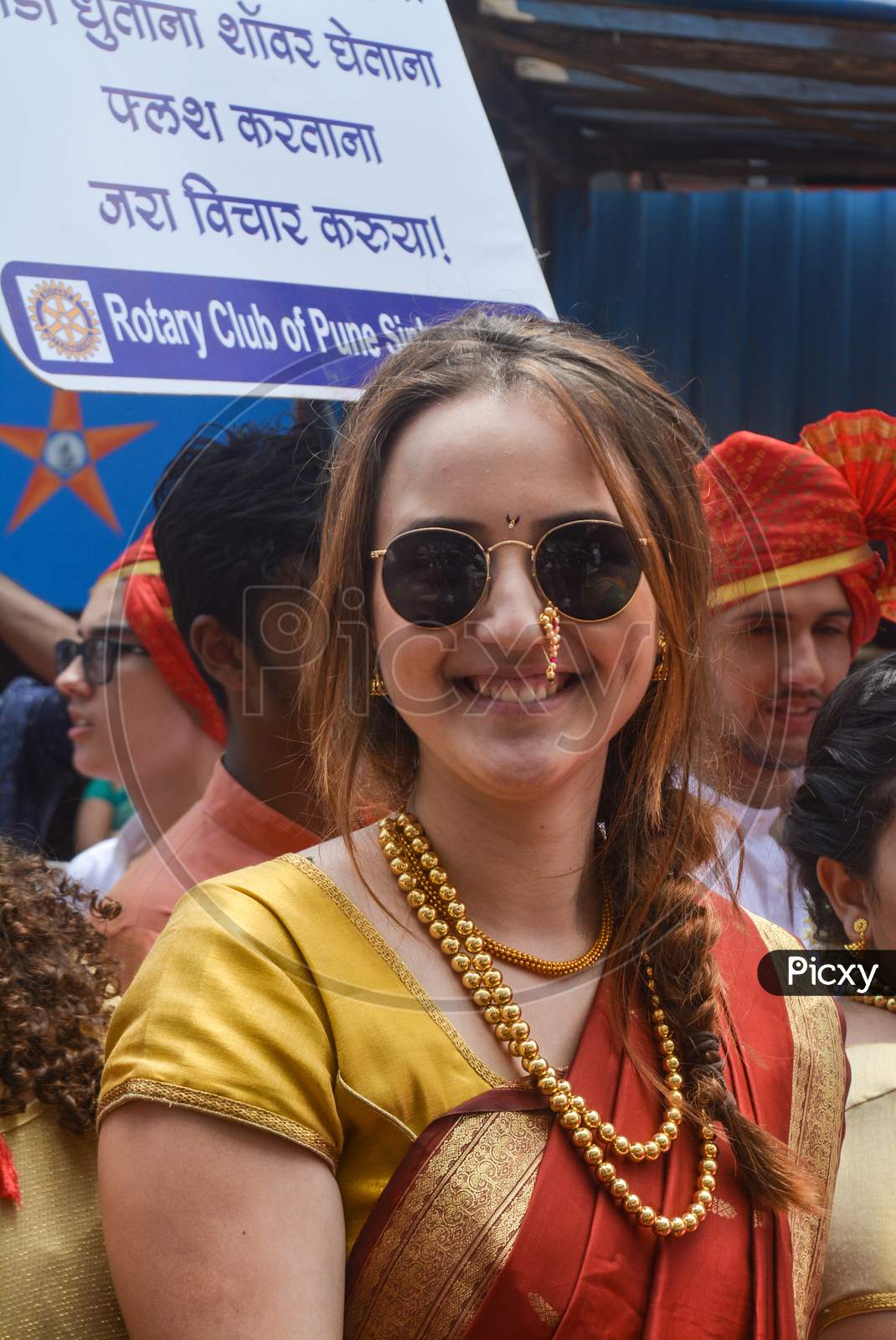 Pune, India - September 4, 2017: A Member Of Rotary Club Wearing Traditional Hindu Saree During Ganpati Visarjan Festival In Pune. Foreign Members Of The Rotary Club During Ganpati Visarjan Festival.