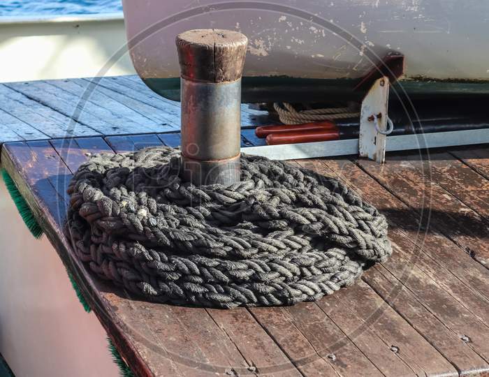 Detailed Close Up Detail Of Ropes And Cordage In The Rigging Of An Old Wooden Vintage Sailboat