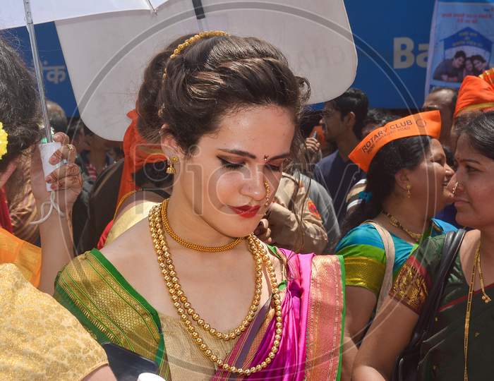 Pune, India - September 4, 2017: A Member Of Rotary Club Wearing Traditional Hindu Saree During Ganpati Visarjan Festival In Pune. Foreign Members Of The Rotary Club During Ganpati Visarjan Festival.