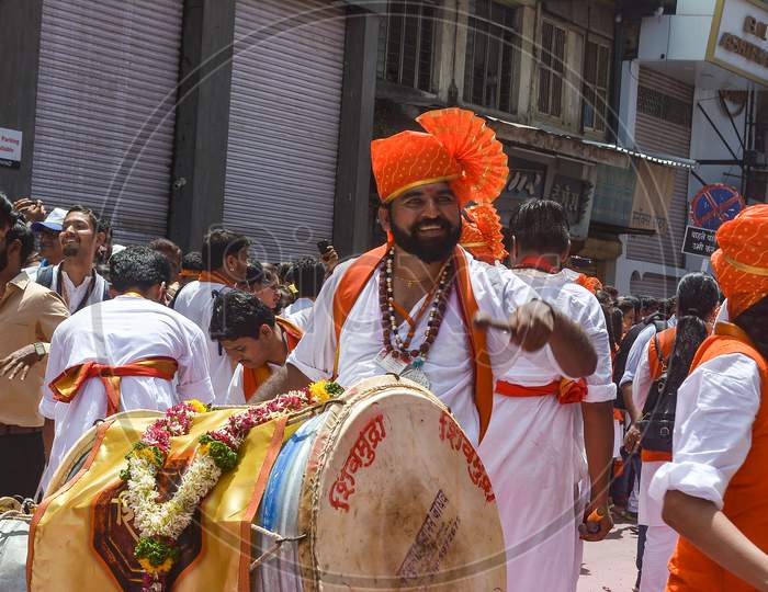 Pune, India - September 4, 2017: Closeup Of A Member From Shivmudra Dhol Tasha Pathak Happily Playing Dhol / Drum On The Streets Of Pune On The Occasion Of Ganpati Visarjan Festival.