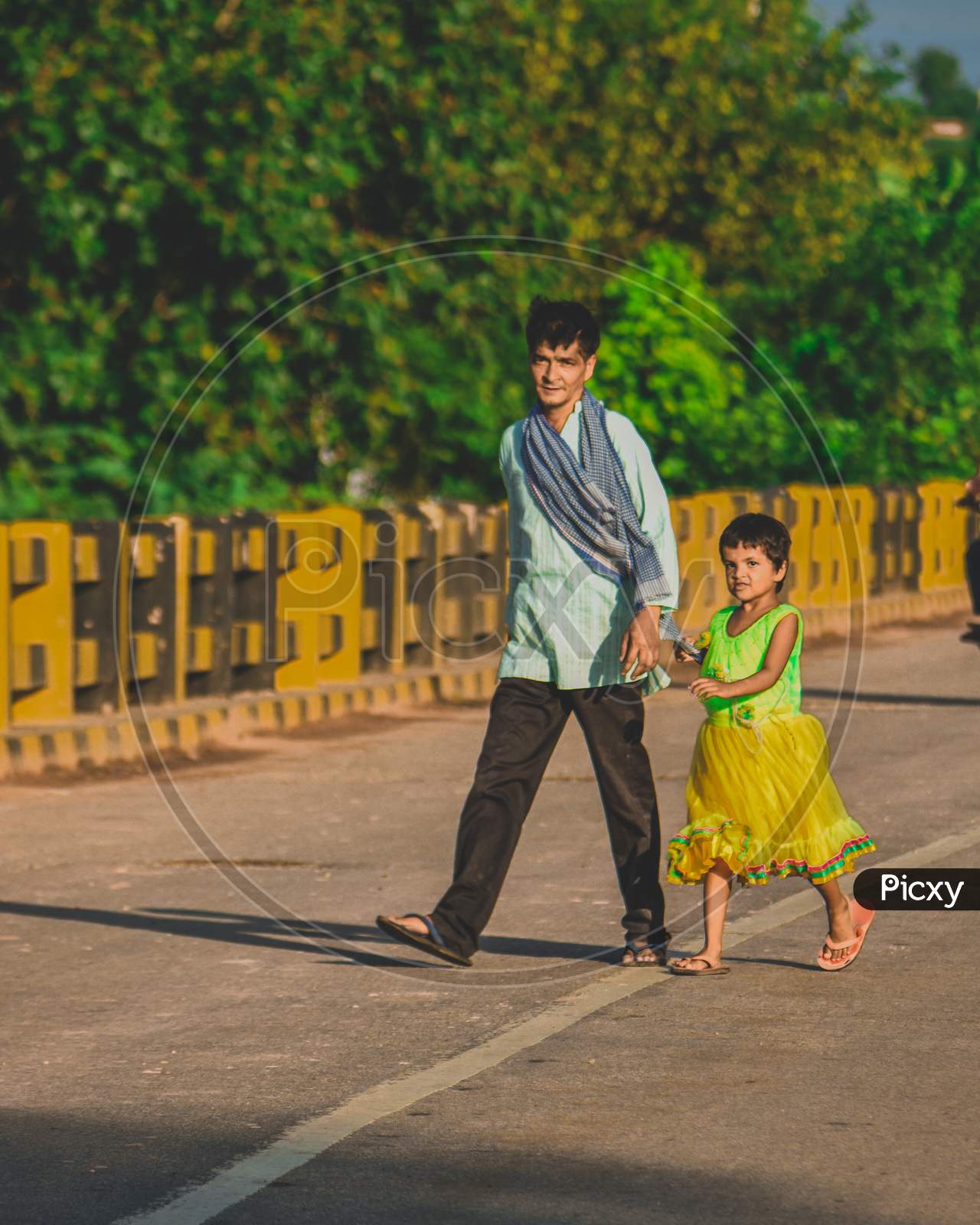 A father walking with his daughter