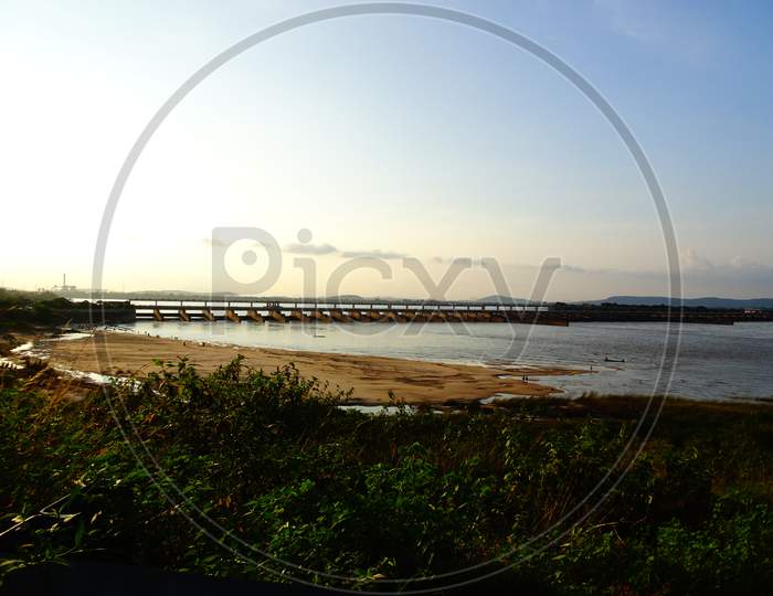 Sunset landscape view of Naraj Barrage with flood gates on Mahanadi river when human meets nature