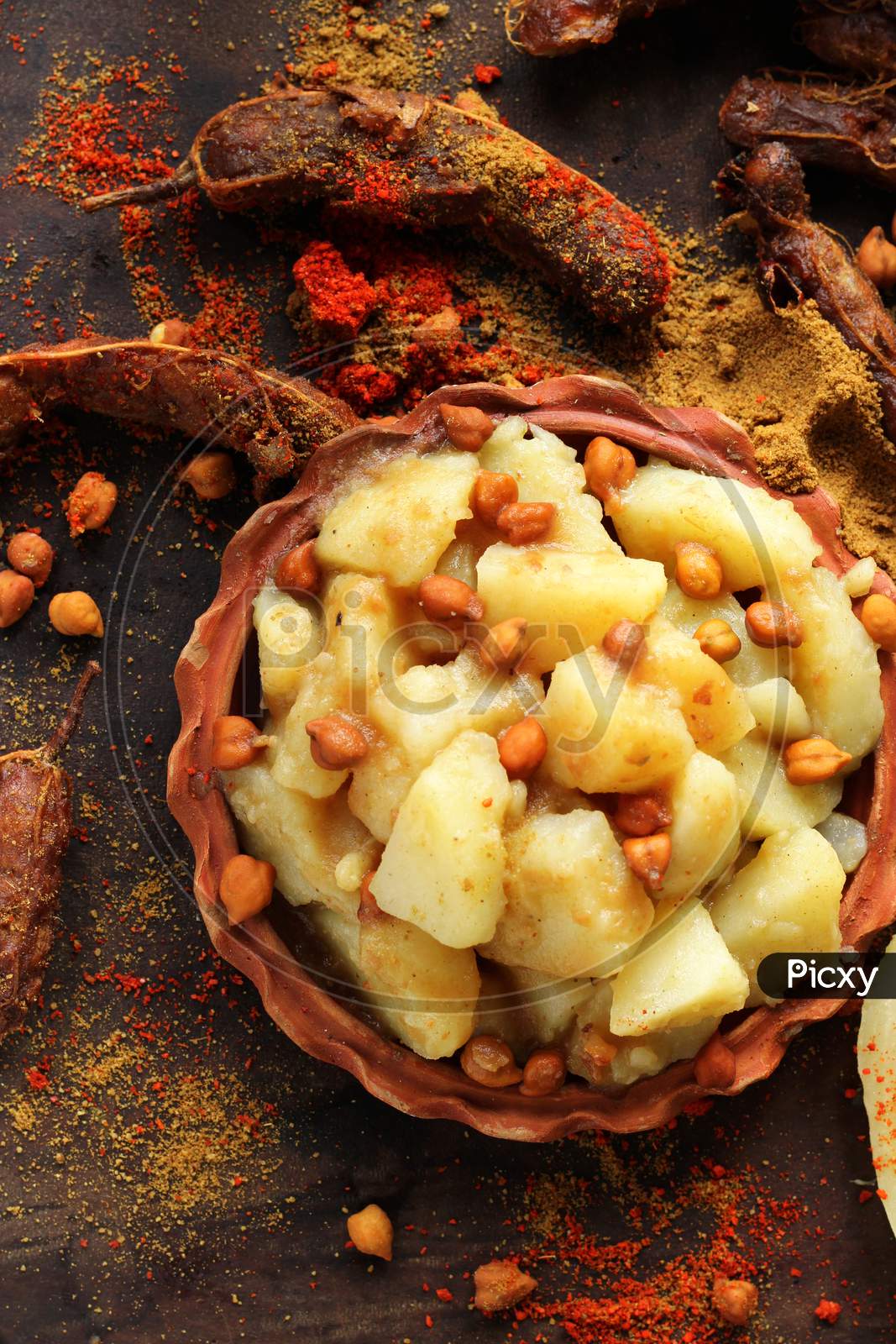 Popular Bengali street food, Alu-kabli, served in earthen plate