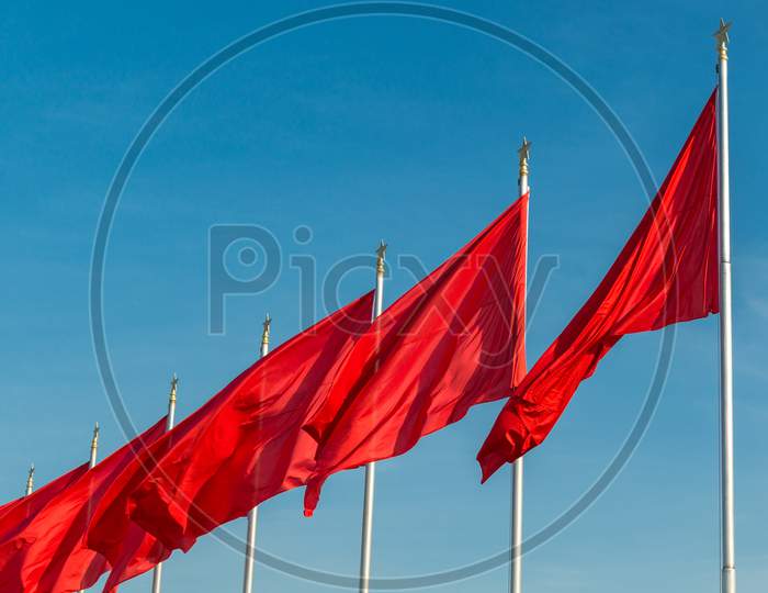 Red Banners Unfurled In The Wind At Tiananmen Square In Beijing, China