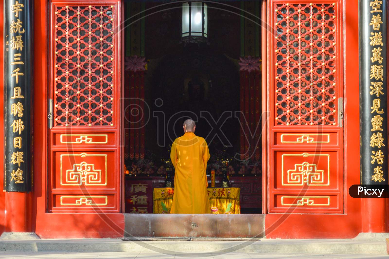 Buddhist Monk Performing Ritual At Fayuan Temple In Beijing, China
