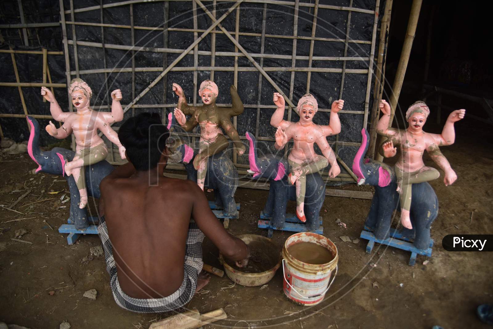 An Artist Is Sculpting The Vishwakarma Idols With Clay Ahead Of Vishwakarma Puja In Nagaon District Of Assam On Sep 07,2020.