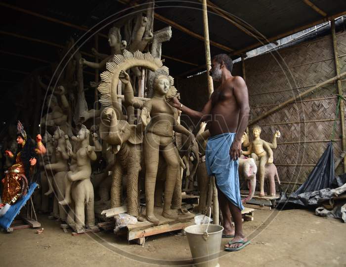 An Artist Is Sculpting The Vishwakarma Idol With Clay Ahead Of Vishwakarma Puja In Nagaon District Of Assam On Sep 07,2020.