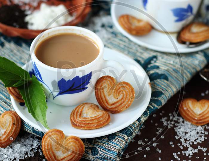 beautiful cup of tea with cookies