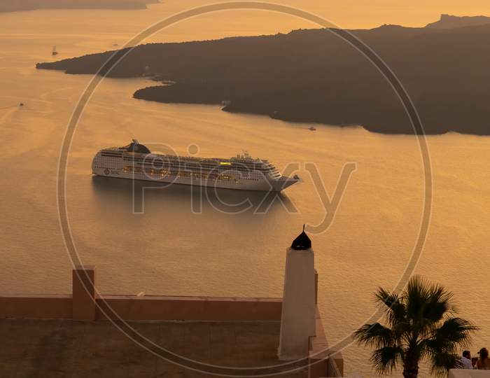 Cruise Ship At Anchor During Sunset
