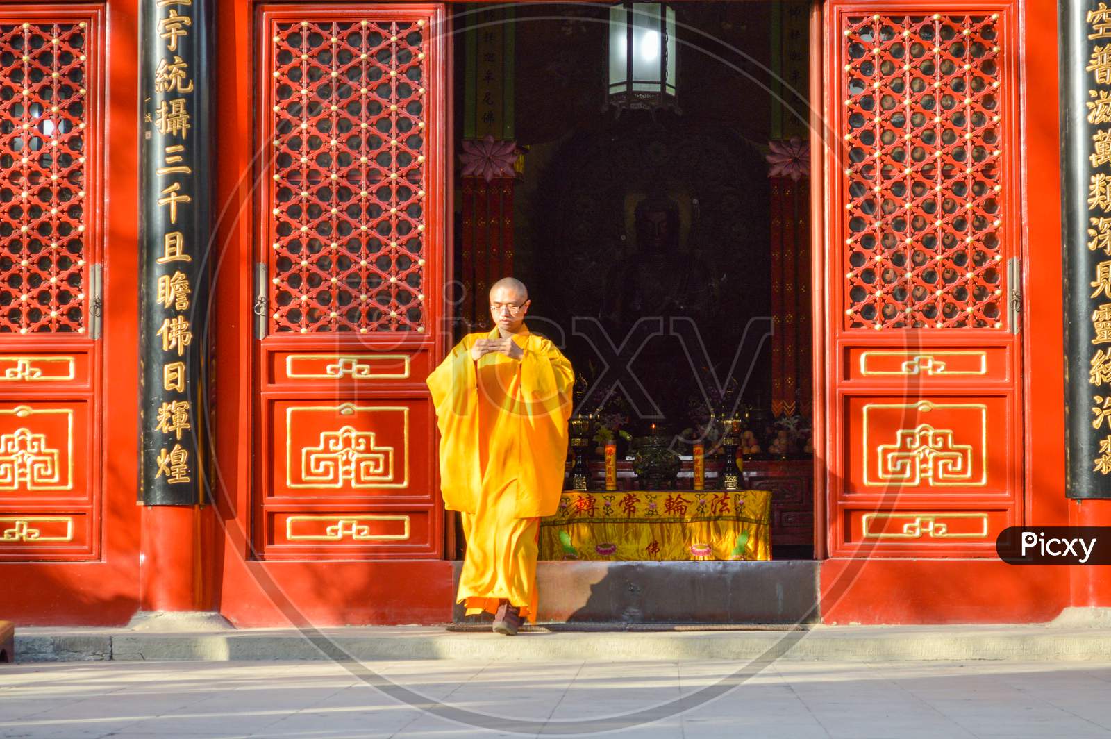 Buddhist Monk Performing Ritual At Fayuan Temple In Beijing, China