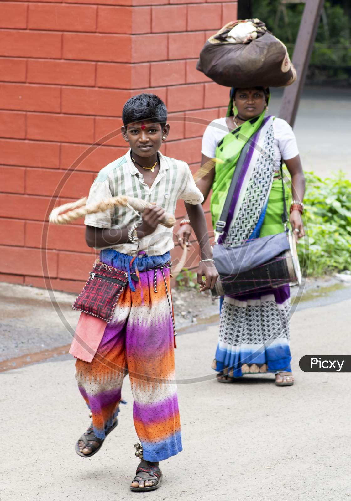 Teenager Boy And His Mother Belonging To The Potraj Community Of Devotees To The Goddess Kadak Lakshmi Performing Self-Flagellation To Drumbeats