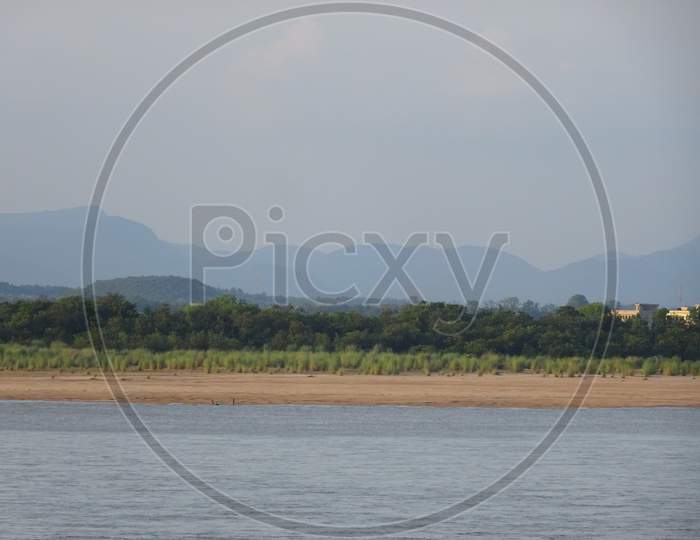 View of Mahanadi river at Naraj making beautiful perfect landscape of river, shore, sand, trees, mountains with different shades