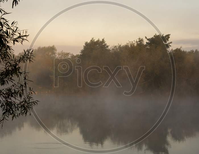 Peaceful Early Morning Mist Over Lake. Tranquil English scenery