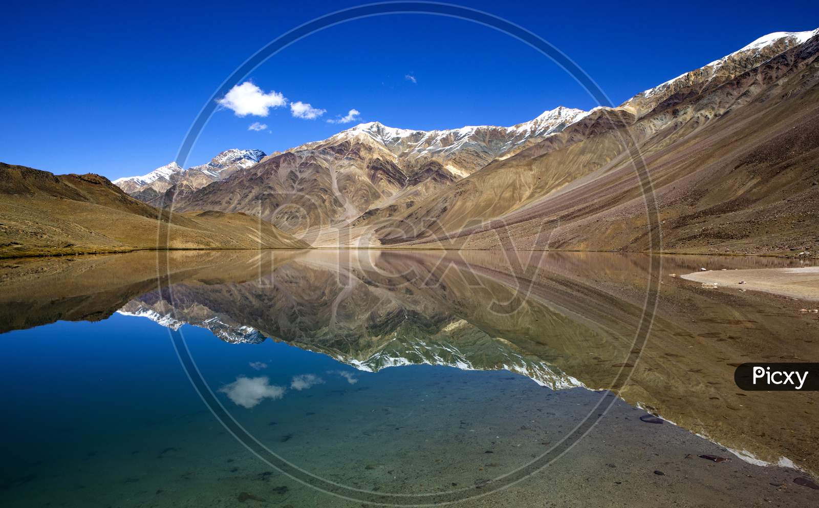 Reflection Of Mountains On Chandra Tal Lake At An Altitude Of 14000 Ft. on The Himalaya
