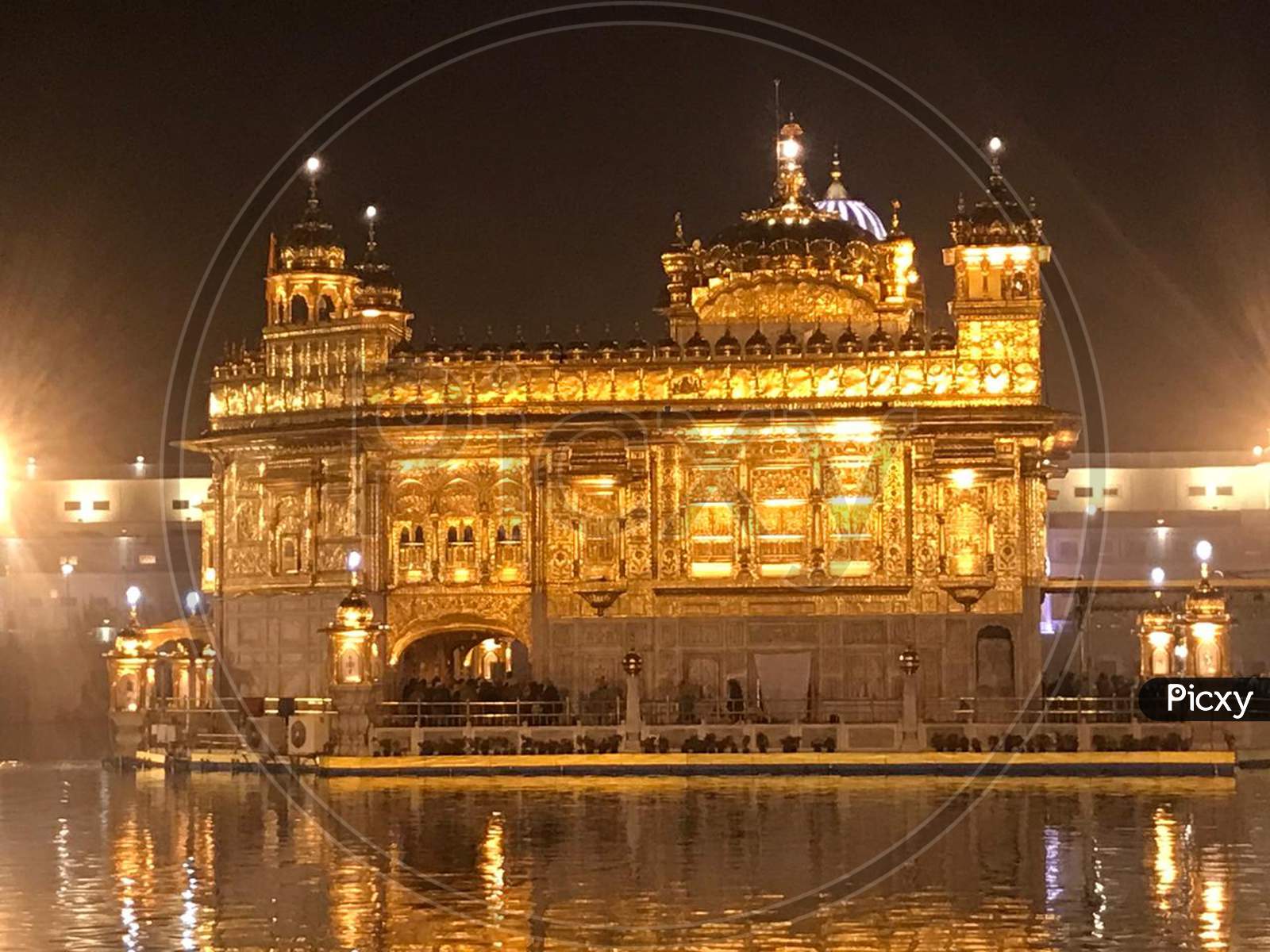 Golden temple with its reflection in water