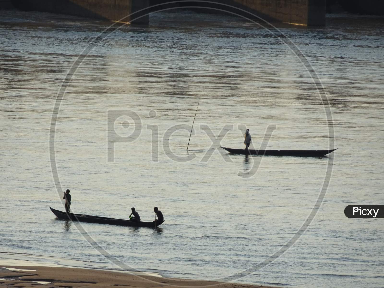 Fisherman fishing on boat in the Mahanadi river at Naraj, Cuttack