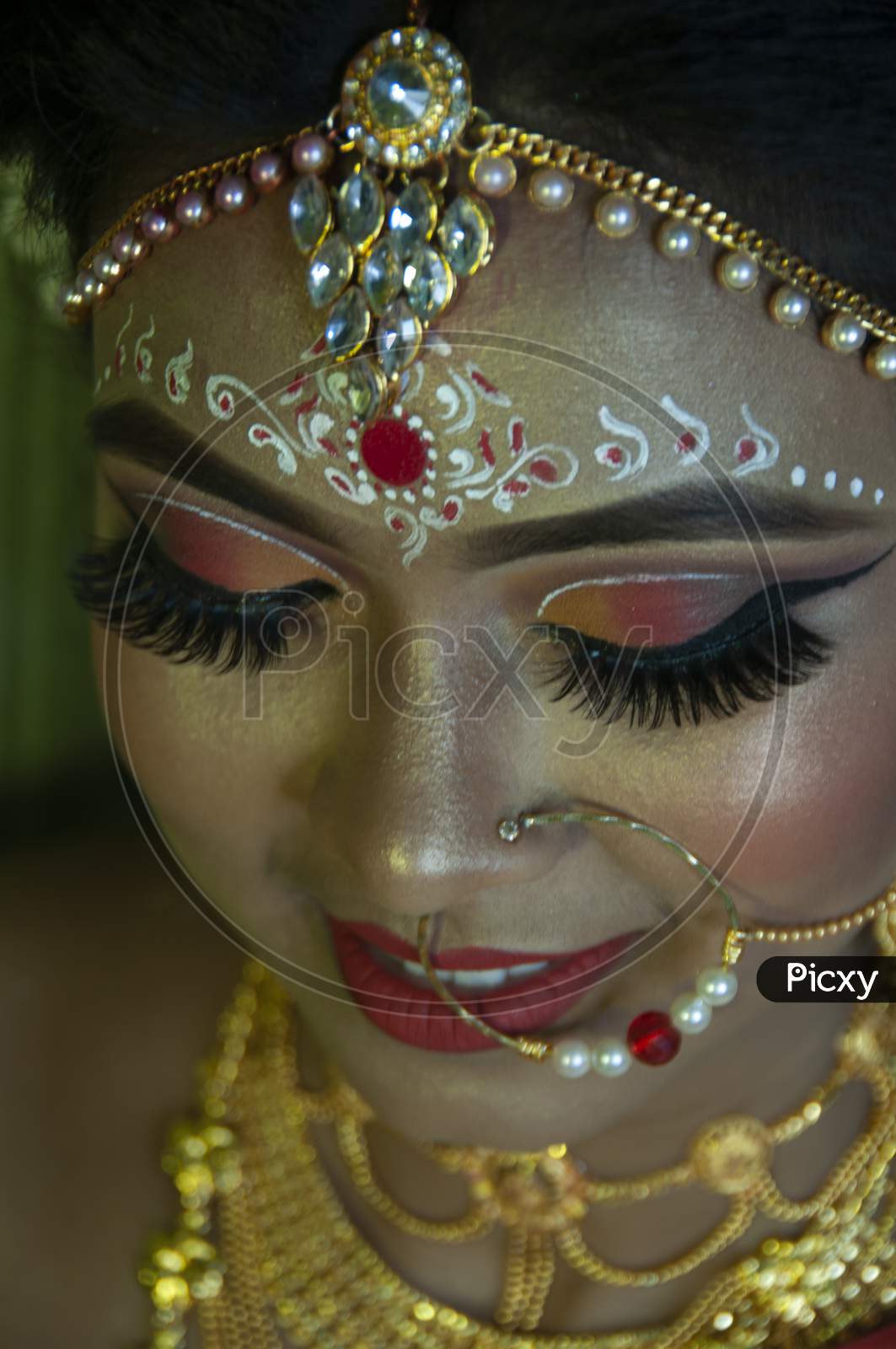 A Girl In Her Marriage Day Showing Her Eye Makeup