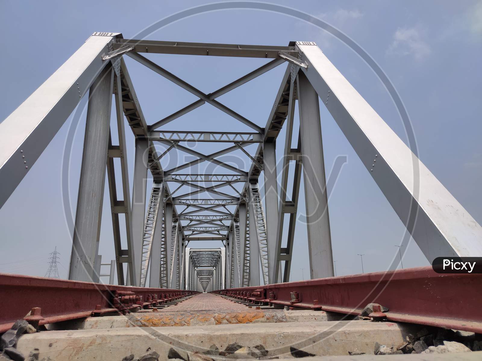Railway Tracks Iron Bridge Unique Angle Shot With Flat Sky