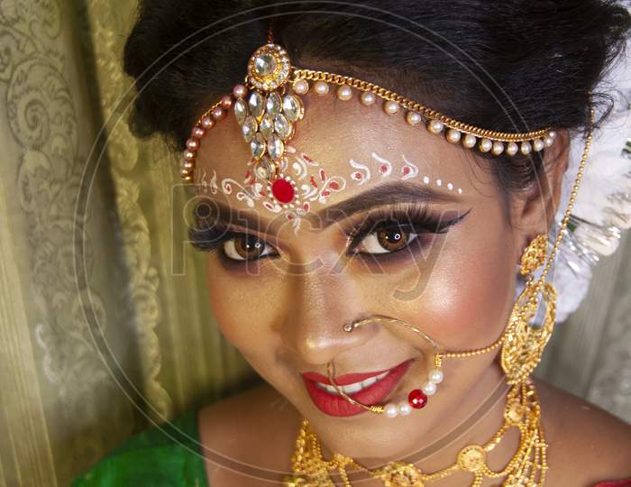 An Indian Woman With Bridal Makeup