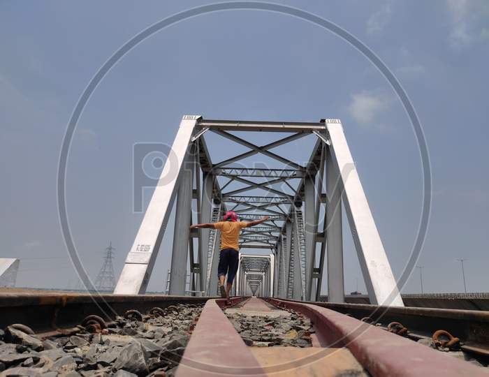 Man At Railway Tracks Iron Bridge Unique Angle Shot