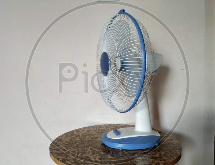 Electric Table Fan Blue Color isolated on white background