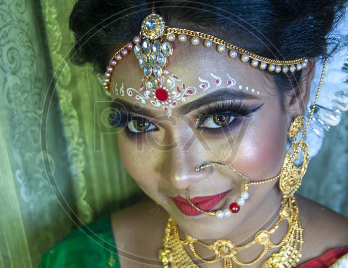 An Indian Woman With Bridal Makeup