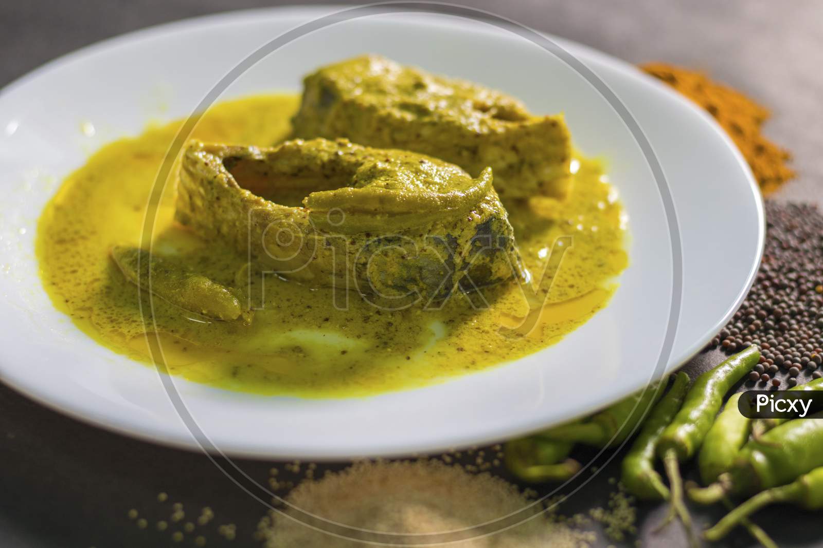 Famous Bengali Dish Hilsa/Ilish fish with poppy and mustard seed recipe.