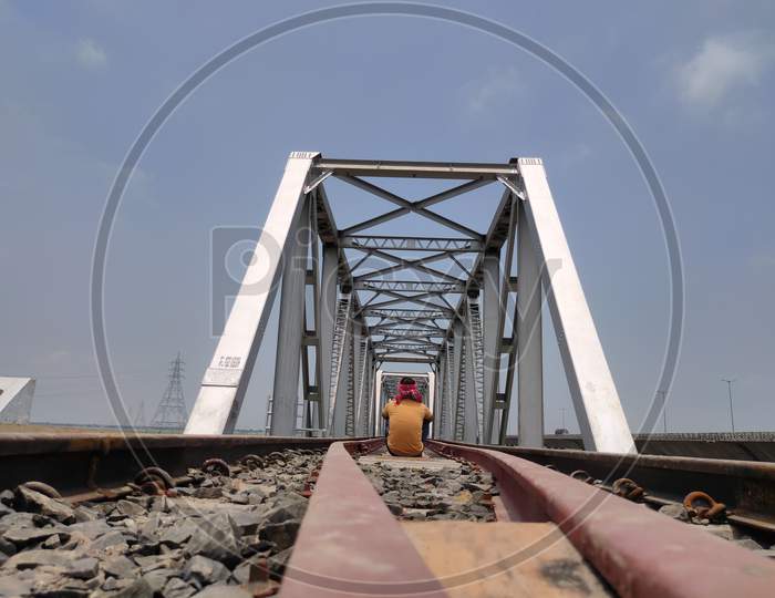 Man At Railway Tracks Iron Bridge Unique Angle Shot