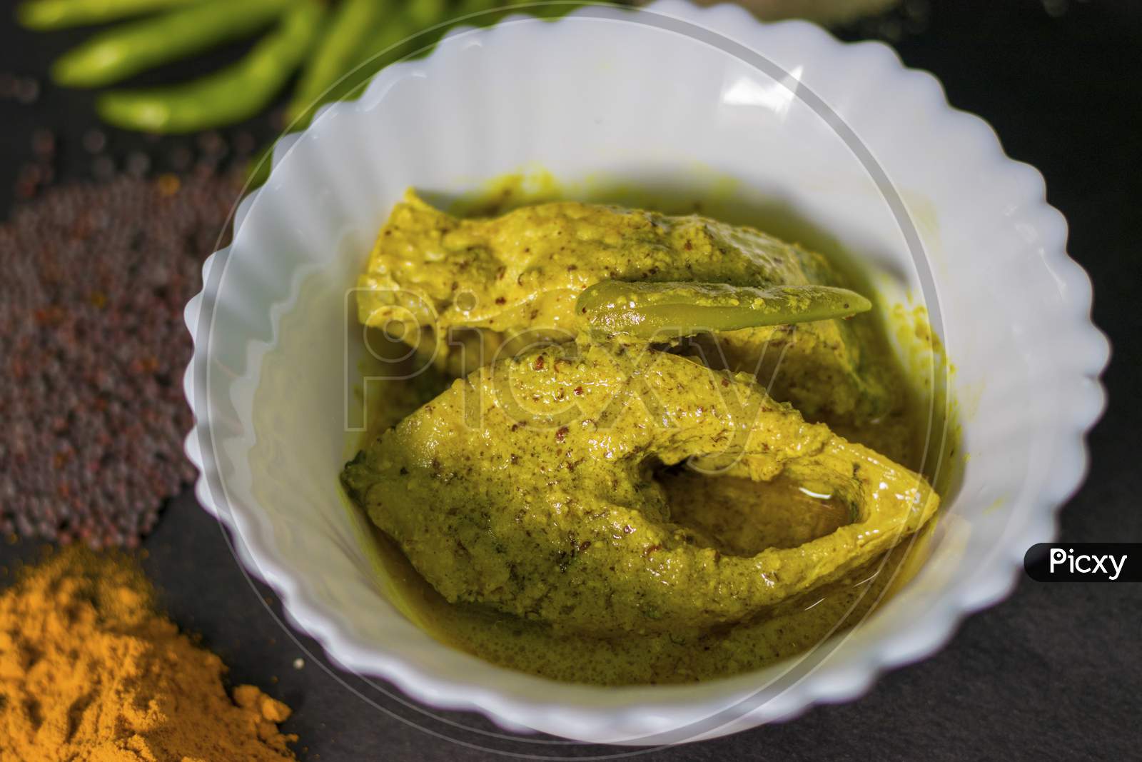 Famous Bengali Dish Hilsa/Ilish fish with poppy and mustard seed recipe.