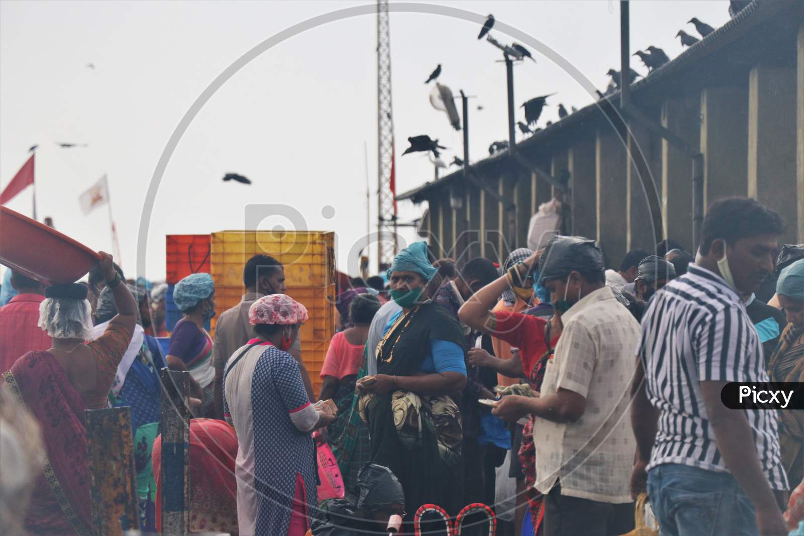 People are seen at a fish market amidst the spread of the coronavirus disease (COVID-19) in Mumbai, India on September 7, 2020.