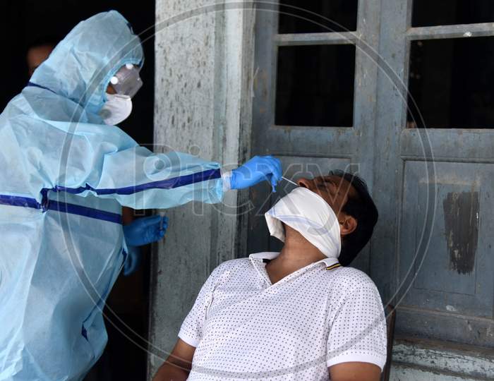 An Indian health worker takes a nasal swab sample to test for COVID-19 in Nagaon District of Assam on Sep 08,2020