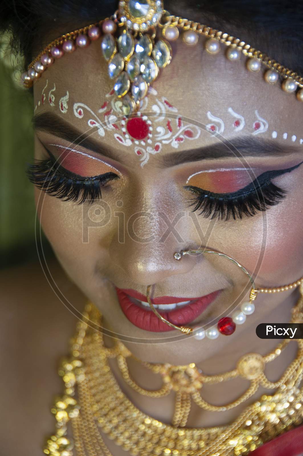 A Girl In Her Marriage Day Showing Her Eye Makeup